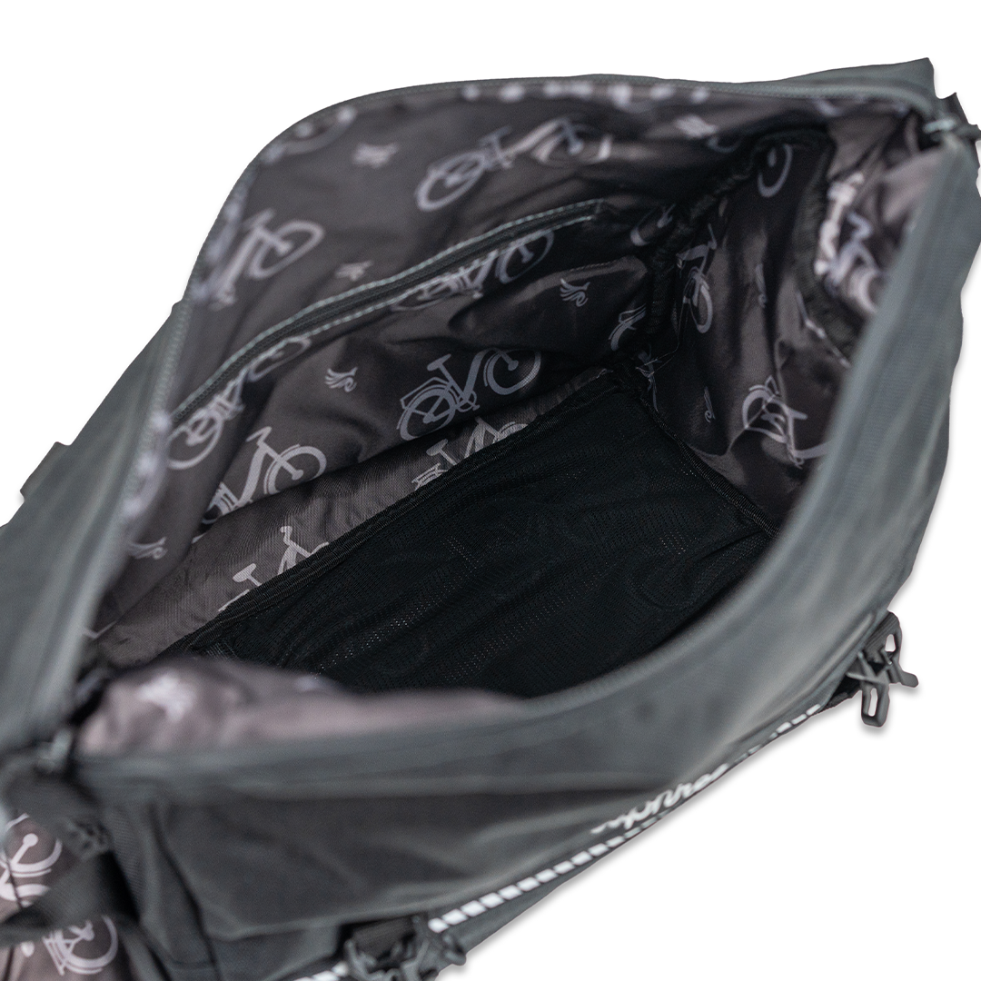 Close-up of the Euphree Trunk Bag, showcasing the interior liner design featuring the iconic Euphree bird logo. The spacious compartments provide organized storage for valuables during rides, combining functionality with stylish branding.