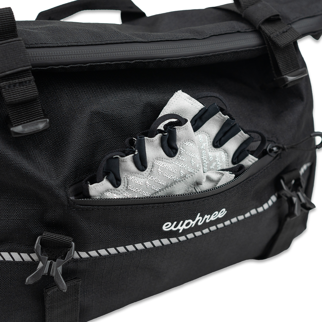 Close-up of the Euphree Trunk Bag with the front zipper open, displaying Euphree cycling gloves stored inside. The bag offers convenient, secure storage with easy access for essential items during your ride.