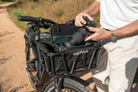 Close-up of Euphree front basket liner with zippered compartments and bottle pocket.