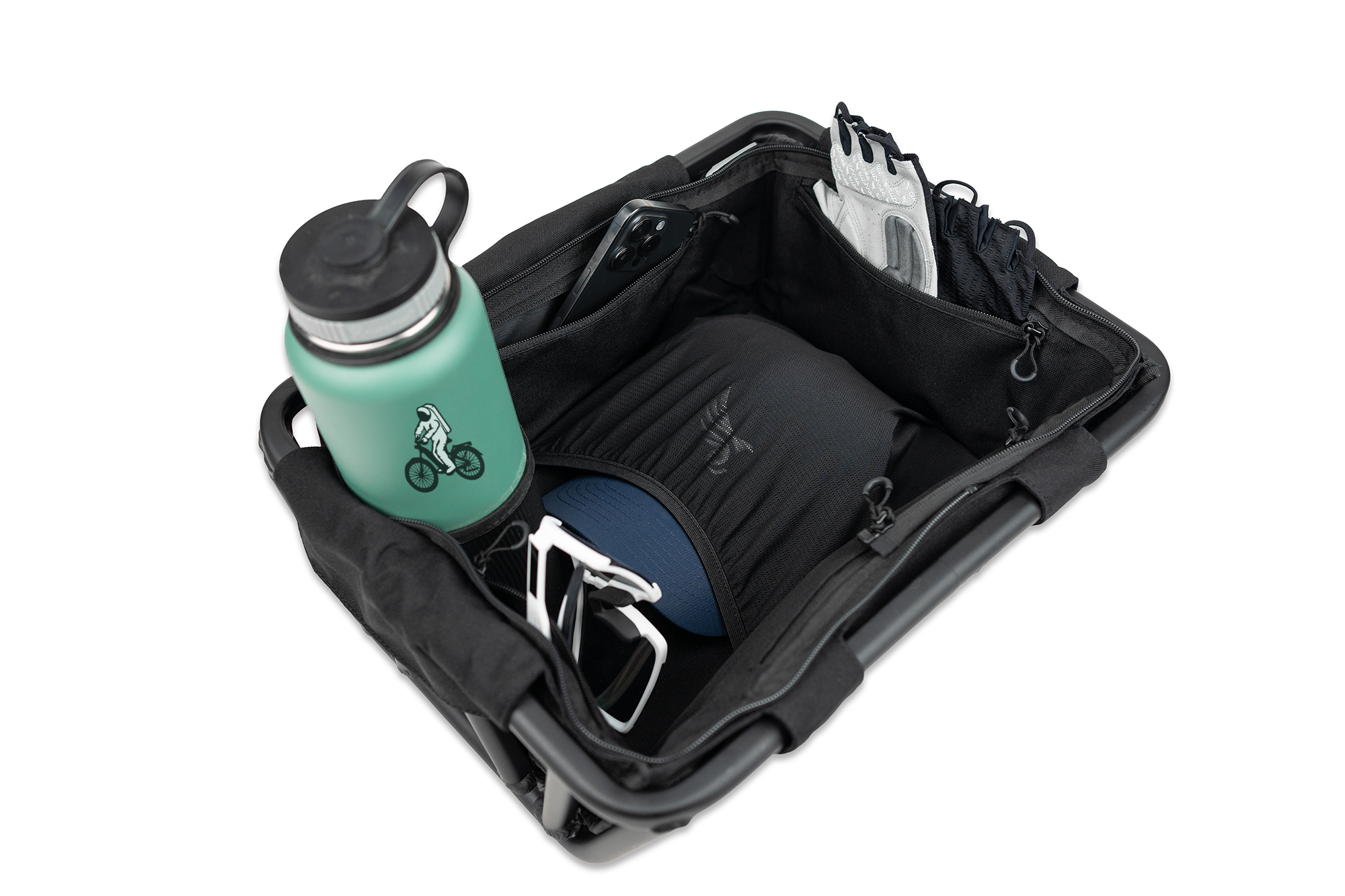 Euphree Front Basket Liner filled with accessories, including a Euphree cap, riding gloves, water bottle, iPhone, and cycling shades, showcasing its spacious design and storage capability.