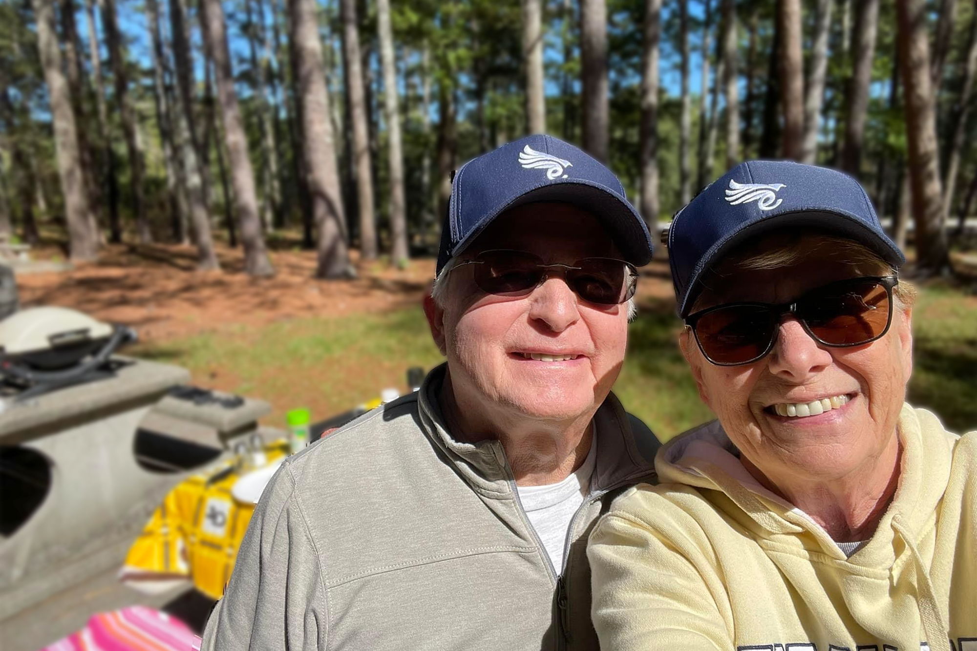 Couple taking a selfie wearing Euphree Adjustable Snapback Cap, enjoying a ride together.