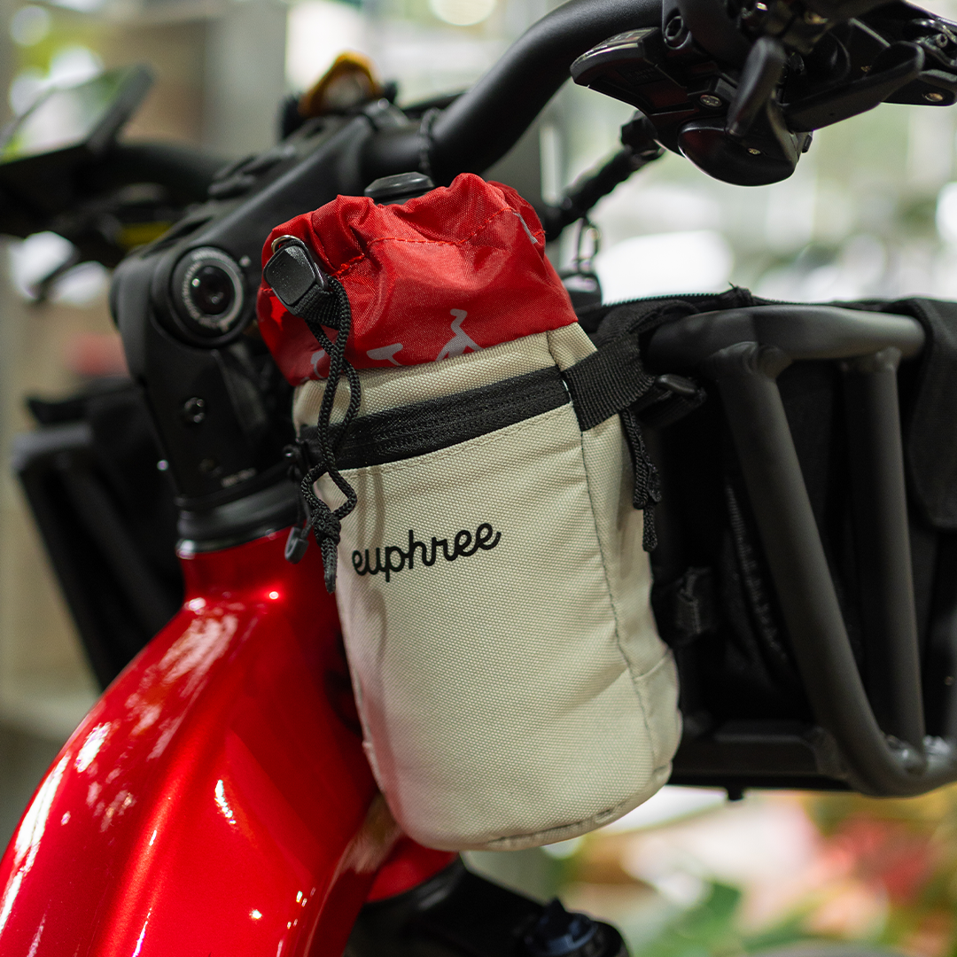 Close-up view of the red and khaki stem bag attached to the Stellar Falcon, highlighting its compact storage and durable design, ideal for securing personal items during rides.