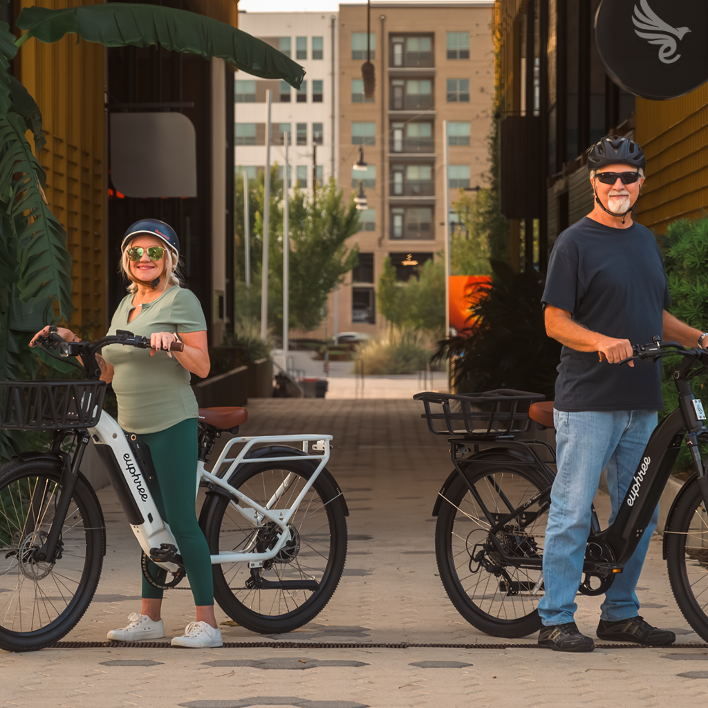 Couple standing beside their Euphree City Robin X+ ebikes, smiling and enjoying the outdoors. Highlighting Euphree's Black Friday sale: Save $200 on City Robin X+ plus a free accessory bundle valued at $210, totaling $410 in savings.