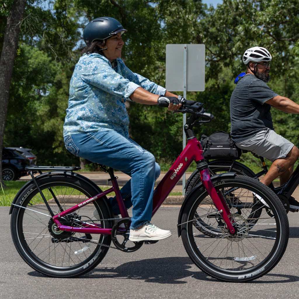 Woman riding the Ultra Violet Solar Sparrow step-through ebike on a sunny day